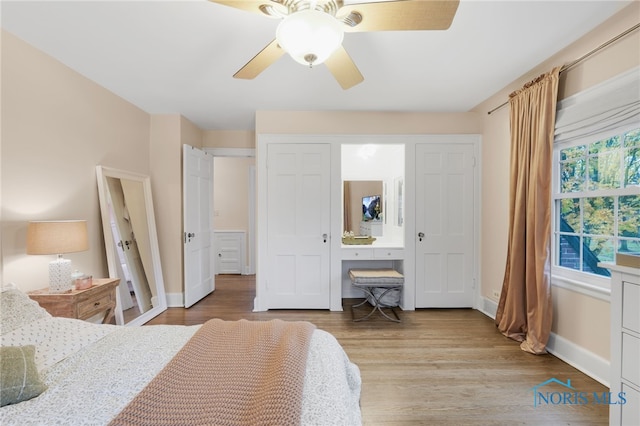 bedroom with ceiling fan and light wood-type flooring