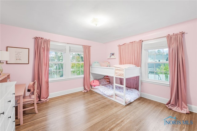 bedroom with light hardwood / wood-style floors