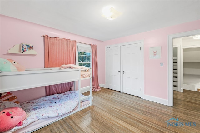 bedroom with wood-type flooring