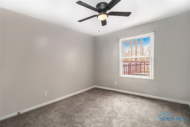 spare room with ceiling fan and carpet floors