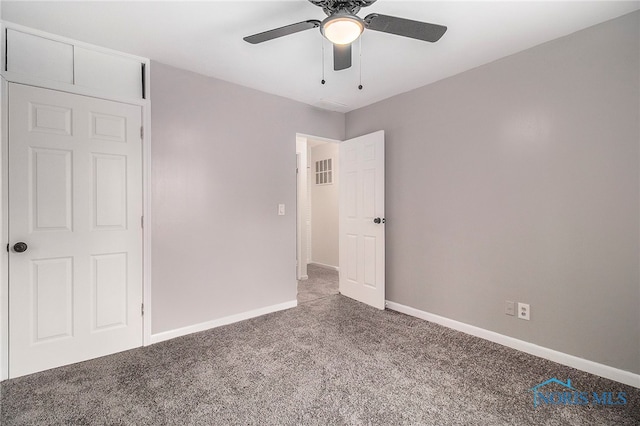 unfurnished bedroom featuring carpet floors and ceiling fan