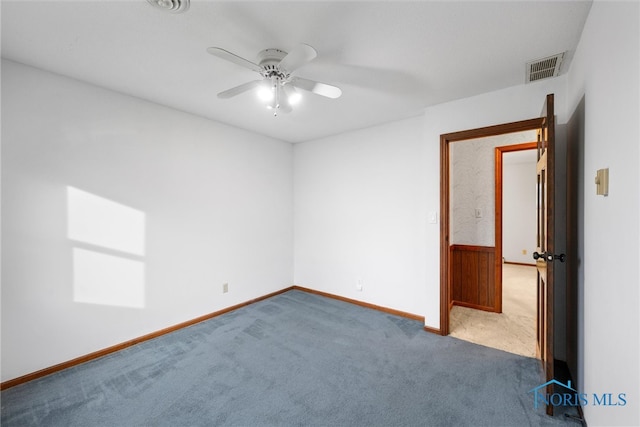 spare room with carpet flooring and ceiling fan