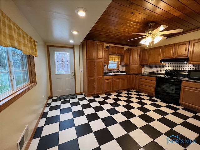 kitchen with ceiling fan, tasteful backsplash, wood ceiling, and black appliances