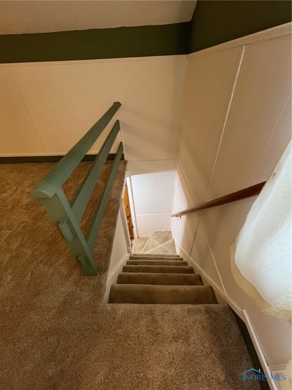 stairs featuring carpet