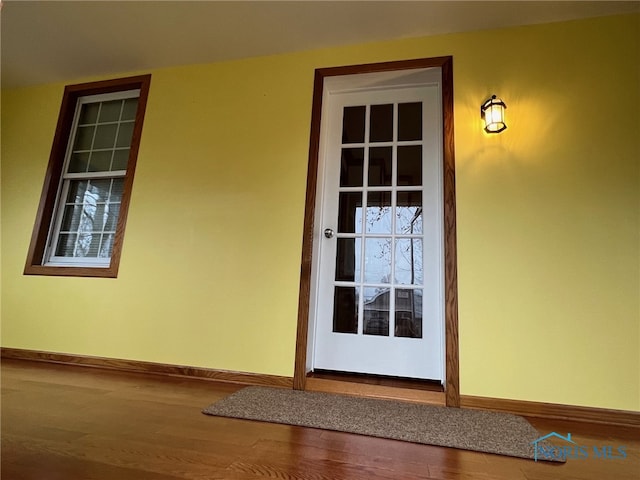 entryway with hardwood / wood-style flooring