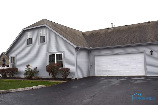 view of property exterior with a garage