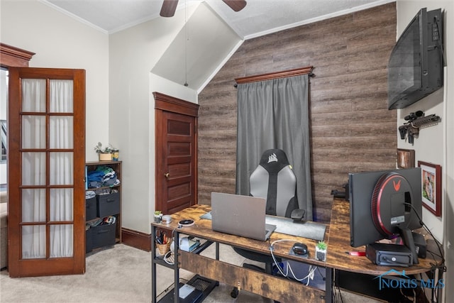 office with wooden walls, ceiling fan, light carpet, and ornamental molding