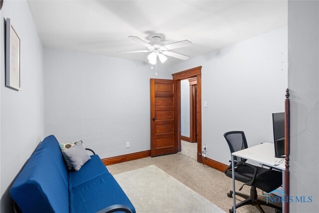 office featuring light colored carpet and ceiling fan