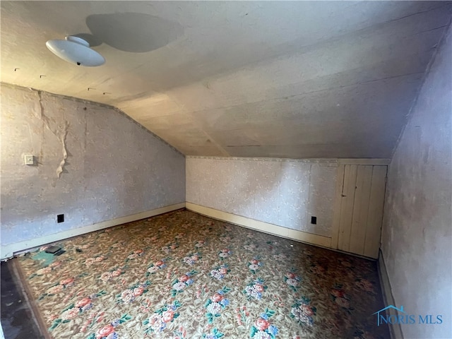 bonus room featuring vaulted ceiling