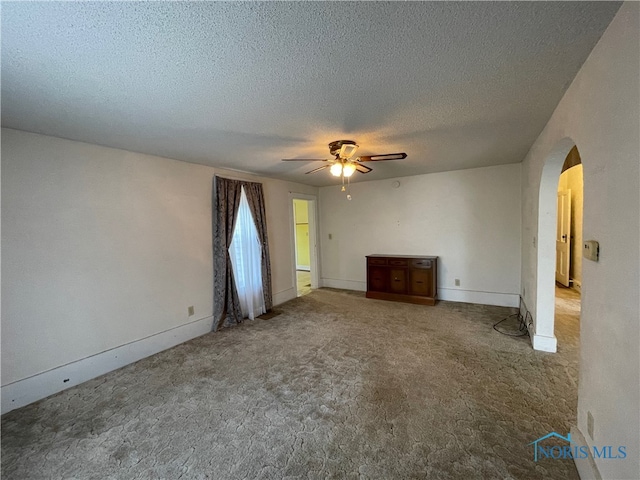 interior space featuring a textured ceiling and ceiling fan