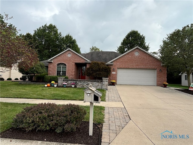 ranch-style house featuring a front yard and a garage