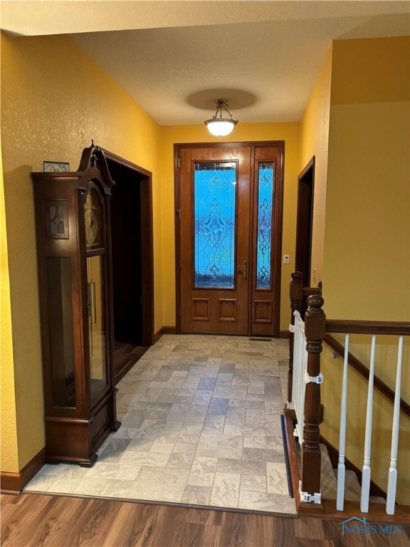 foyer with light hardwood / wood-style floors