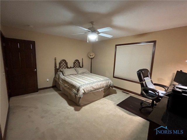 carpeted bedroom with ceiling fan