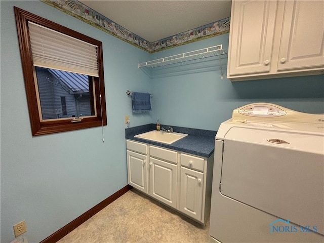 laundry room with cabinets, washer / dryer, and sink