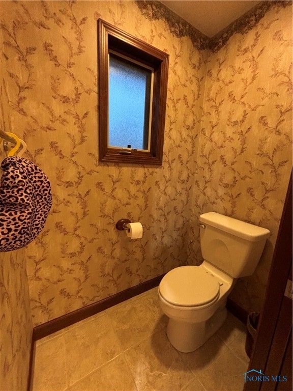 bathroom featuring tile patterned floors and toilet