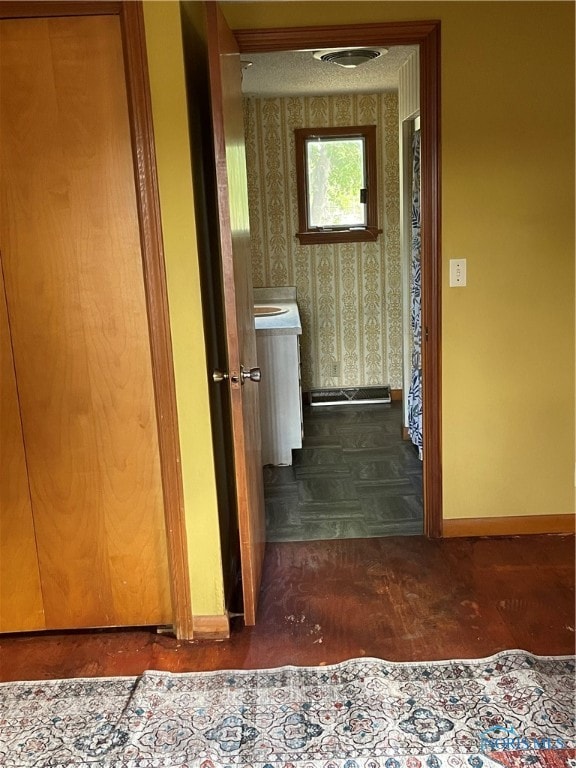 hallway featuring dark hardwood / wood-style floors