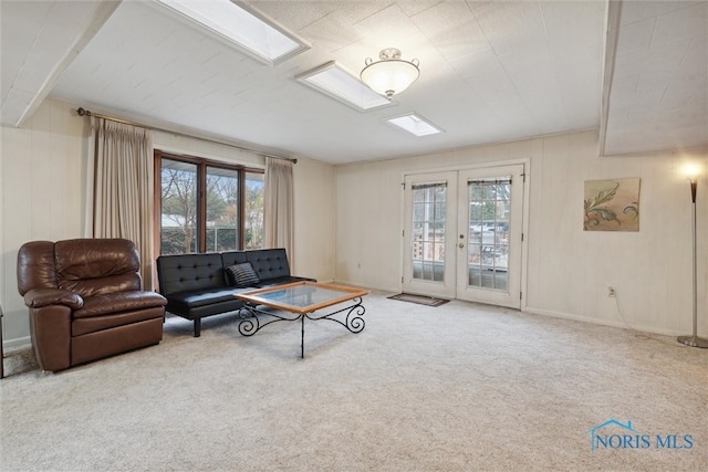 carpeted living room featuring french doors