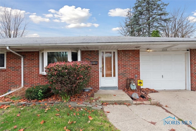 doorway to property featuring a garage