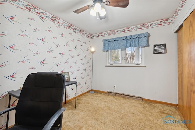 carpeted home office featuring ceiling fan and a baseboard heating unit