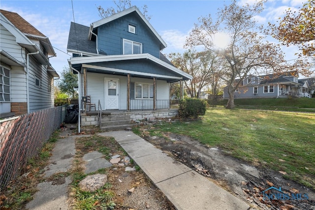 view of front of property with a front lawn and covered porch