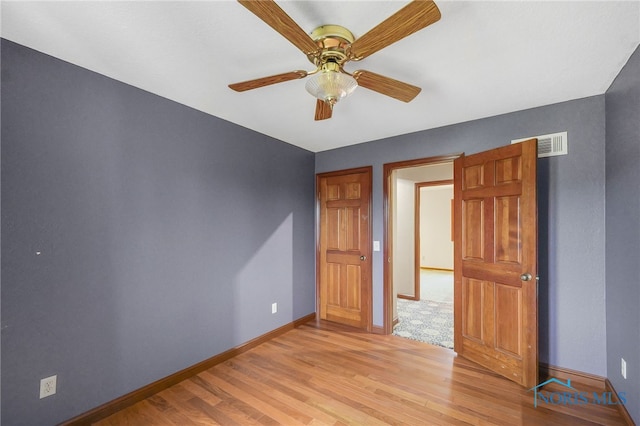 unfurnished bedroom with light hardwood / wood-style flooring and ceiling fan