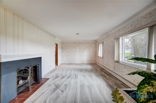 unfurnished living room featuring baseboard heating and a tiled fireplace