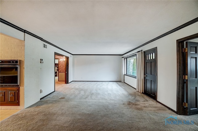 unfurnished living room with light colored carpet and ornamental molding