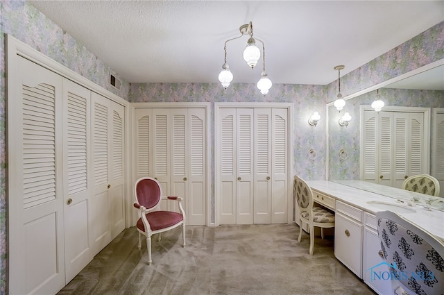 bathroom with vanity and a textured ceiling