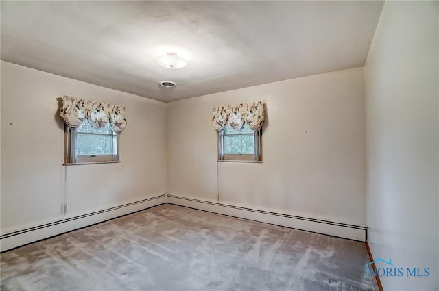 1362 Conneaut Ave, Bowling Green, OH 43402 - carpeted spare room with plenty of natural light and a baseboard radiator