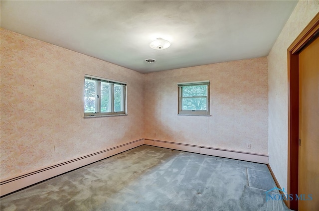 unfurnished room with carpet, a baseboard radiator, and a healthy amount of sunlight