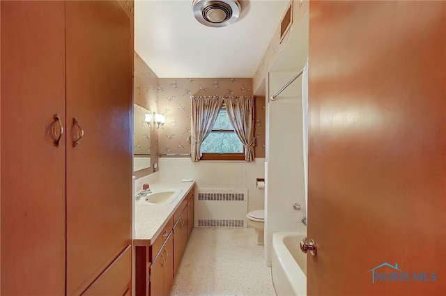 full bathroom featuring radiator, vanity,  shower combination, tile walls, and toilet