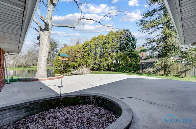 view of patio featuring a water view