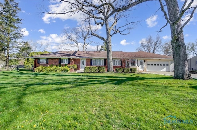 1362 Conneaut Ave, Bowling Green, OH 43402 - ranch-style house featuring a garage, brick siding, and concrete driveway