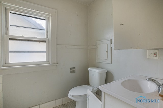 bathroom with tile patterned floors, vanity, and toilet