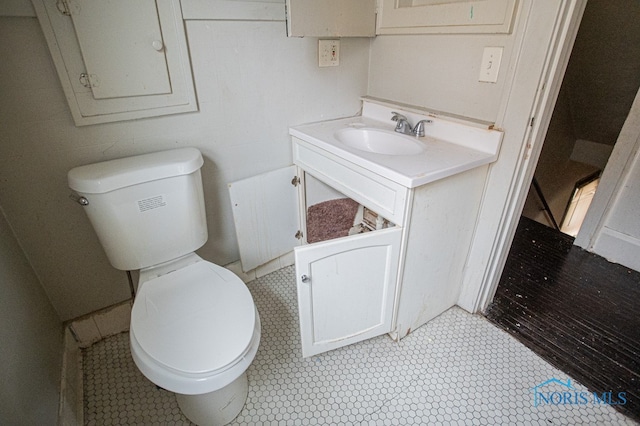 bathroom featuring radiator heating unit, vanity, and toilet