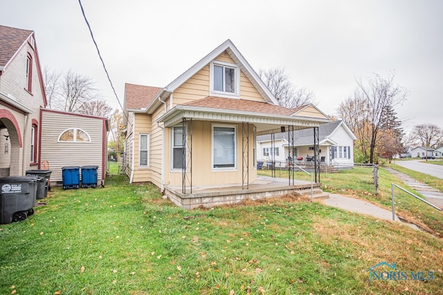 view of front of property featuring a porch and a front lawn