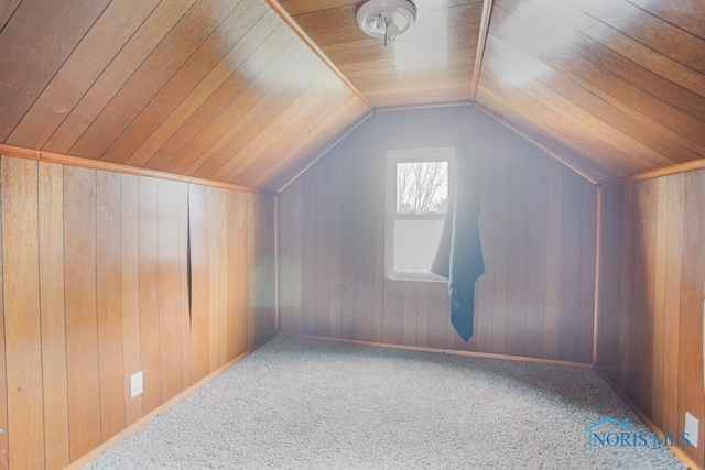 bonus room with carpet flooring, wooden walls, wood ceiling, and lofted ceiling