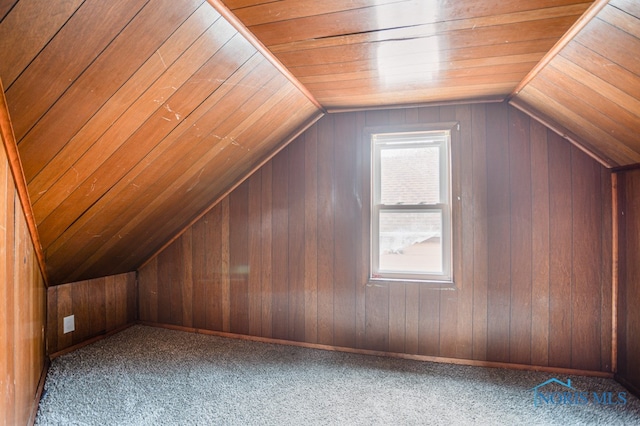 bonus room featuring lofted ceiling, wood walls, wood ceiling, and carpet floors