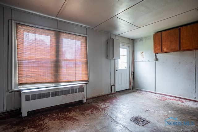 interior space featuring radiator heating unit and concrete floors