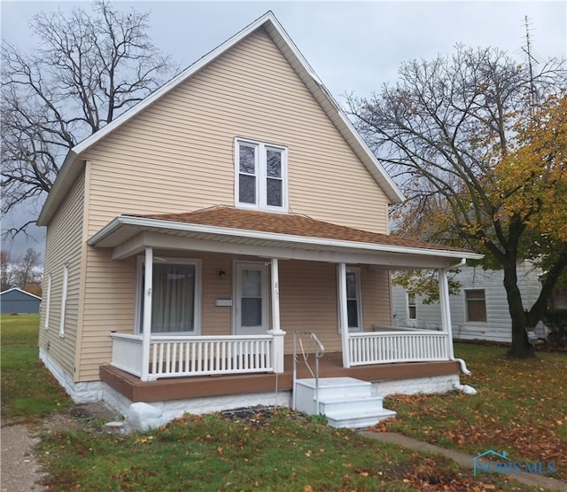 bungalow featuring a front lawn and a porch