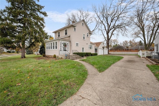 view of side of home with a yard