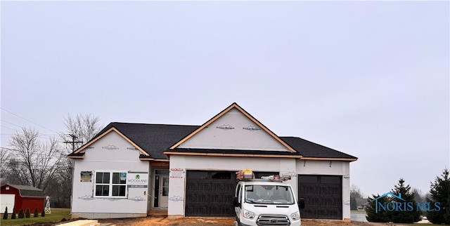 view of front of property with a garage