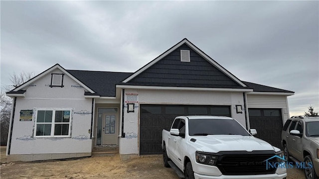 view of front of property with a garage