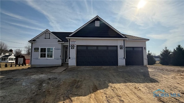 view of front of property with driveway and an attached garage