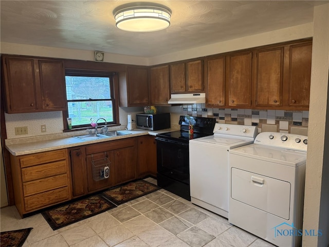 laundry area with sink and washer and dryer