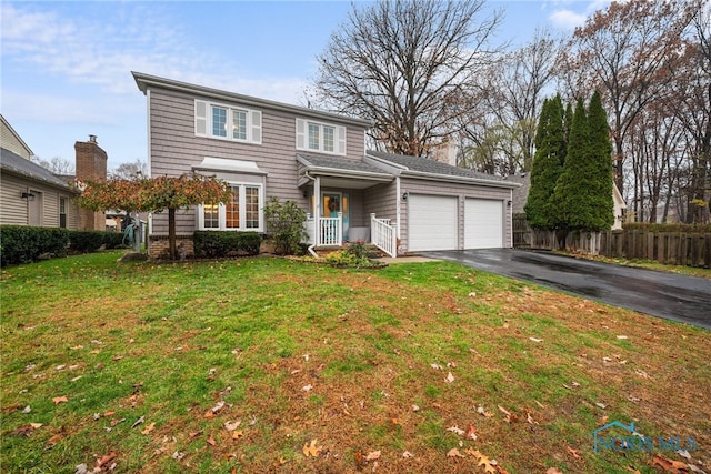 front of property featuring a garage and a front yard