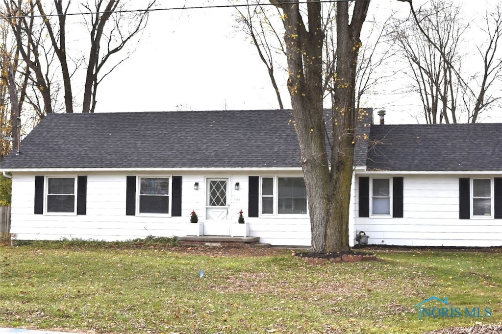 ranch-style house with a front lawn