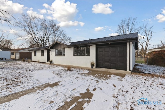 ranch-style home with a garage