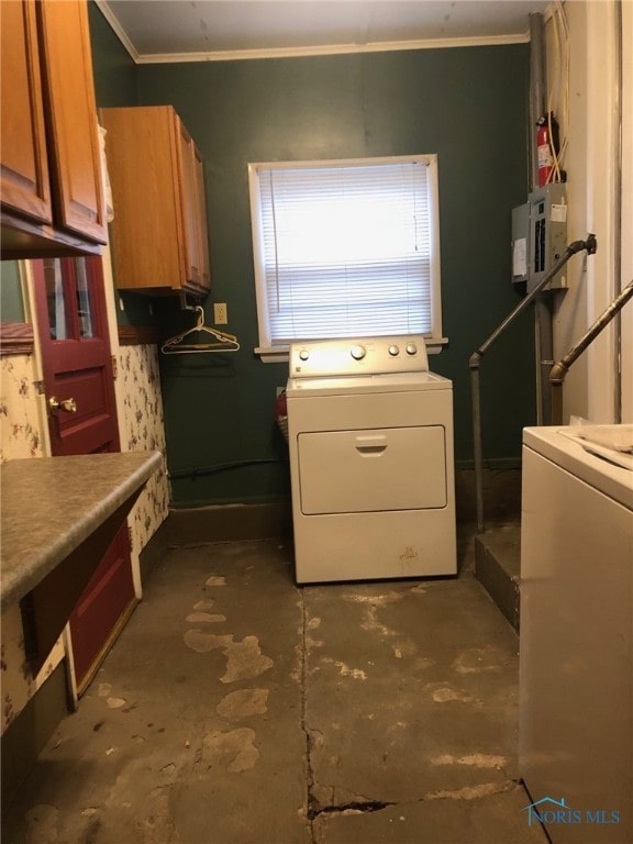 laundry area with electric panel, washer and dryer, cabinets, and ornamental molding