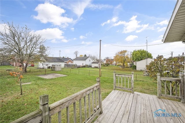 wooden terrace with a yard